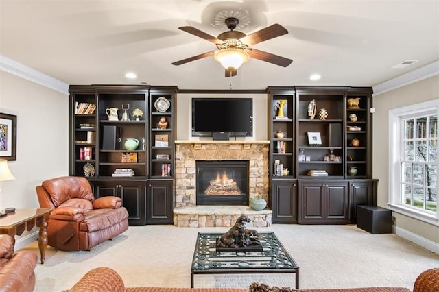 living room featuring a fireplace, light colored carpet, ceiling fan, and ornamental molding