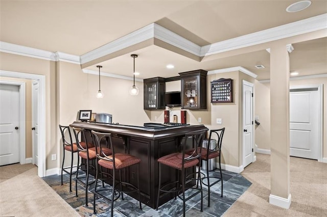 bar with decorative light fixtures, dark brown cabinets, ornamental molding, and carpet floors