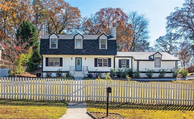 view of front of property with a front lawn