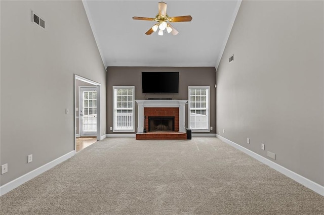 9507 Greens Mill Ct, Loganville, GA 30052 - unfurnished living room featuring carpet flooring, a ceiling fan, baseboards, a fireplace, and high vaulted ceiling