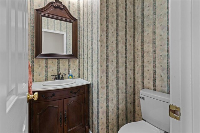 9507 Greens Mill Ct, Loganville, GA 30052 - bathroom with vanity, toilet, and wallpapered walls