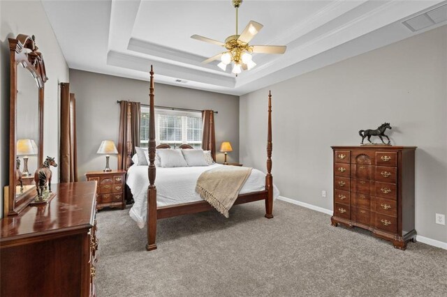 9507 Greens Mill Ct, Loganville, GA 30052 - carpeted bedroom with baseboards, a raised ceiling, and ceiling fan