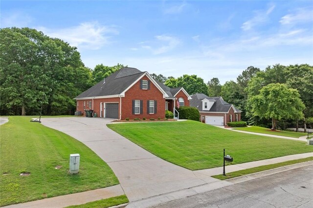 9507 Greens Mill Ct, Loganville, GA 30052 - traditional home with brick siding, a front lawn, an attached garage, and concrete driveway