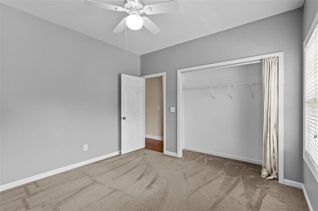 9507 Greens Mill Ct, Loganville, GA 30052 - unfurnished bedroom featuring carpet flooring, a closet, baseboards, and a ceiling fan