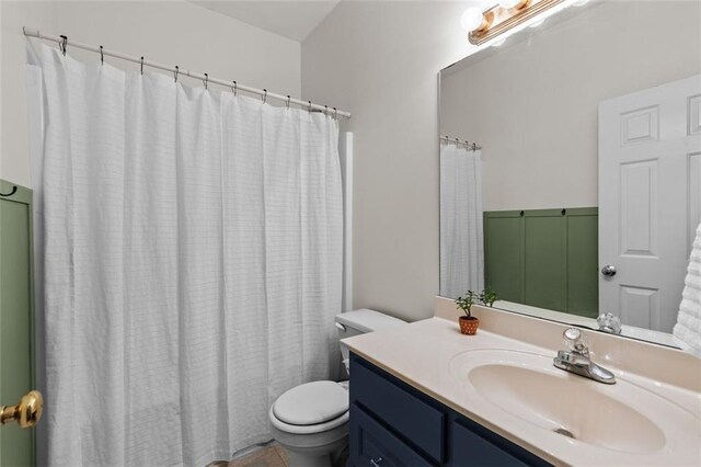 9507 Greens Mill Ct, Loganville, GA 30052 - full bathroom featuring toilet, vanity, and a shower with curtain