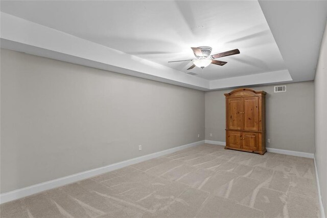 9507 Greens Mill Ct, Loganville, GA 30052 - unfurnished bedroom with a raised ceiling, baseboards, light carpet, and ceiling fan