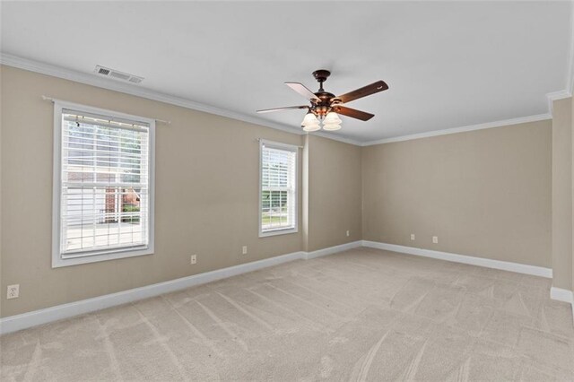 9507 Greens Mill Ct, Loganville, GA 30052 - spare room featuring crown molding, ceiling fan, light carpet, and baseboards
