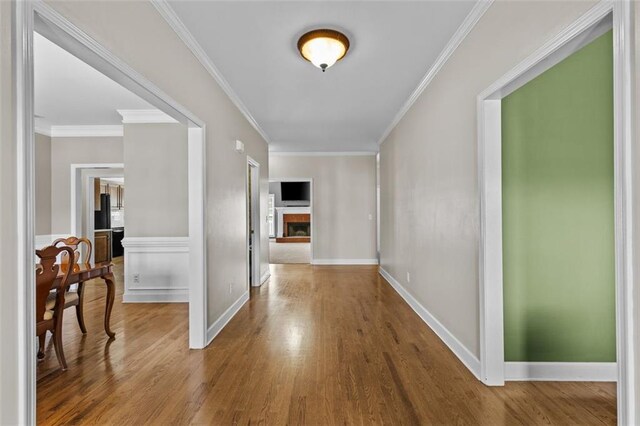 9507 Greens Mill Ct, Loganville, GA 30052 - hallway with wood finished floors, ornamental molding, and baseboards