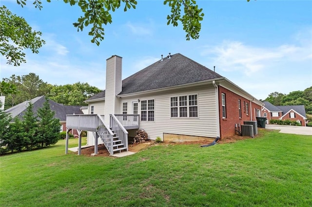 9507 Greens Mill Ct, Loganville, GA 30052 - back of property with a wooden deck, a chimney, a yard, stairway, and cooling unit