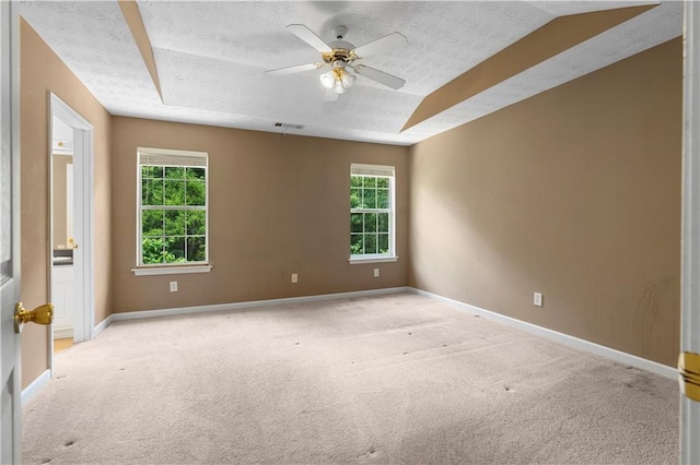 90 Cypress Dr, Covington, GA 30016 - spare room with light carpet, a textured ceiling, baseboards, and a ceiling fan