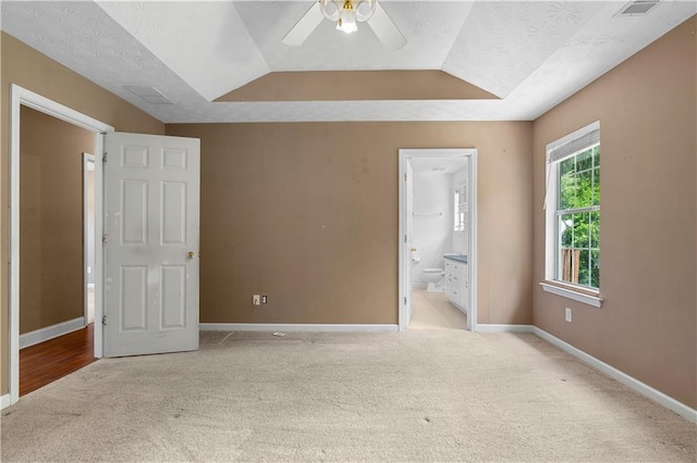 90 Cypress Dr, Covington, GA 30016 - unfurnished bedroom featuring carpet flooring, baseboards, ensuite bath, ceiling fan, and lofted ceiling