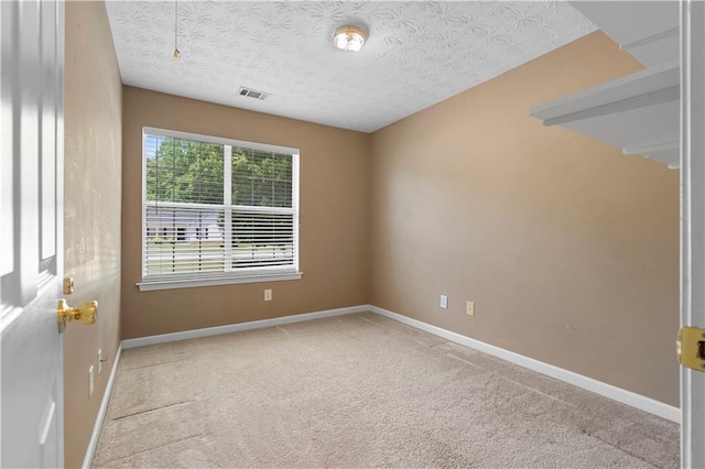 90 Cypress Dr, Covington, GA 30016 - carpeted spare room featuring a textured ceiling and baseboards
