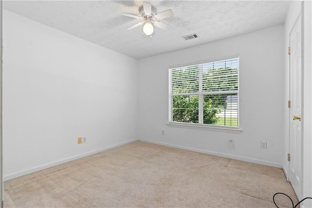 90 Cypress Dr, Covington, GA 30016 - carpeted spare room featuring a ceiling fan, a textured ceiling, and baseboards