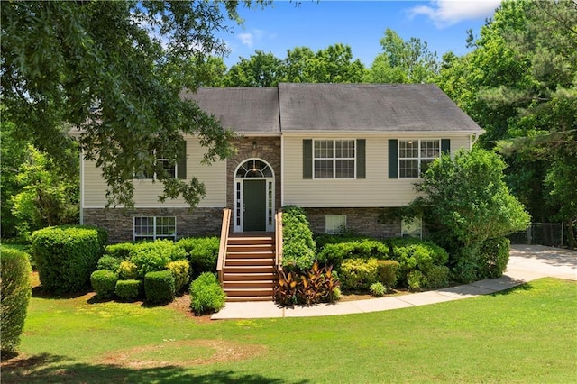 90 Cypress Dr, Covington, GA 30016 - split foyer home with a front yard and stone siding