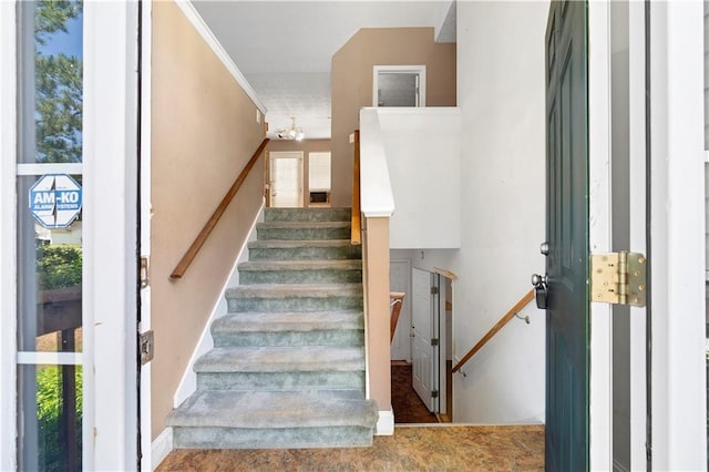 90 Cypress Dr, Covington, GA 30016 - staircase with healthy amount of natural light, a chandelier, and baseboards