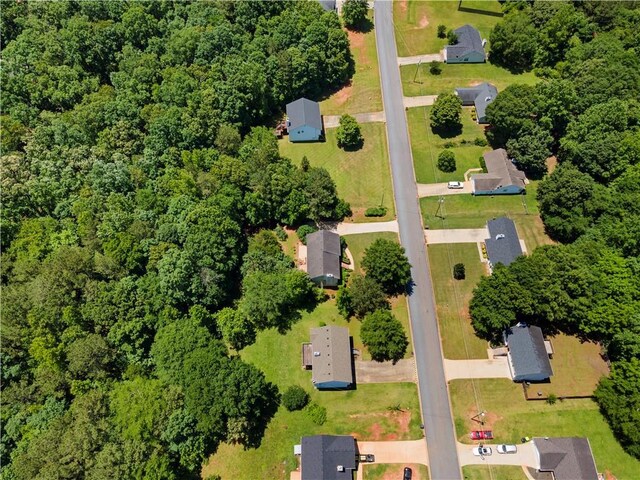 90 Cypress Dr, Covington, GA 30016 - aerial overview of property's location featuring a heavily wooded area