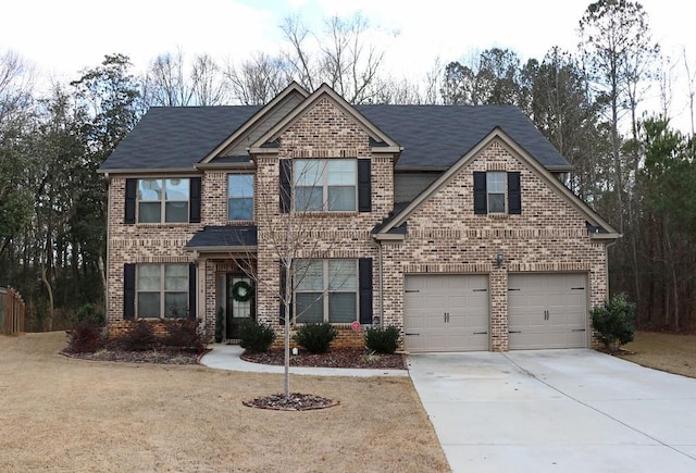 view of front facade with a front lawn and a garage