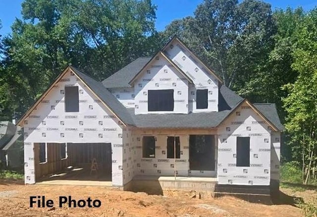 property in mid-construction with covered porch