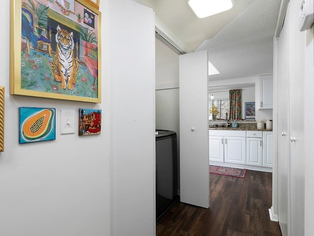 corridor with sink and dark hardwood / wood-style floors