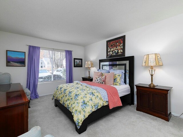 bedroom with light colored carpet