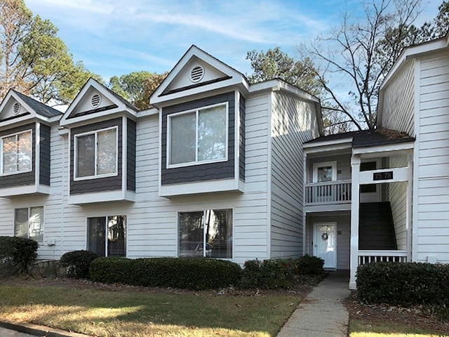 view of property featuring a front yard