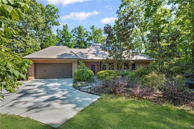 6324 Chesla Dr, Gainesville, GA 30506 - ranch-style home with concrete driveway, a garage, stucco siding, and a front lawn