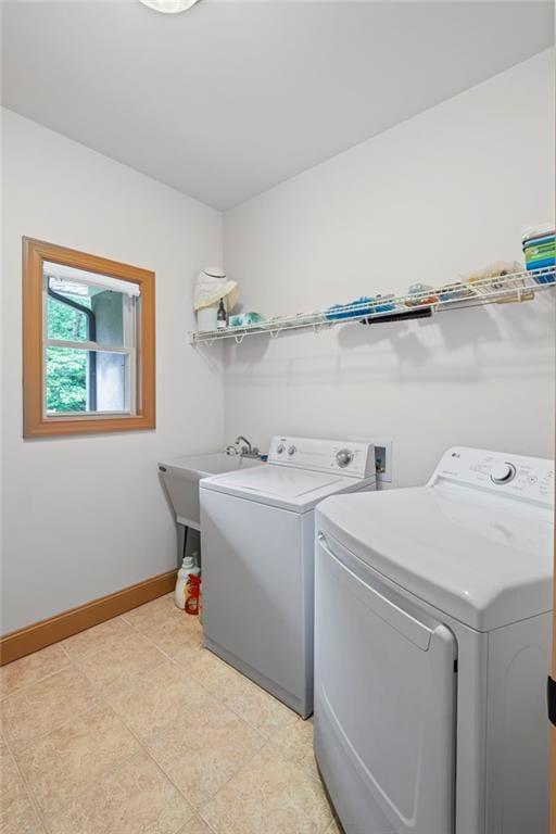 6324 Chesla Dr, Gainesville, GA 30506 - clothes washing area featuring washer and clothes dryer, baseboards, and light tile patterned flooring