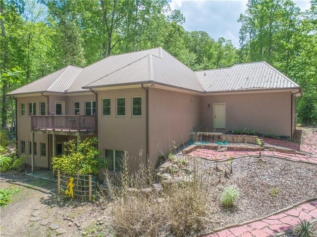 6324 Chesla Dr, Gainesville, GA 30506 - back of property featuring stucco siding and metal roof