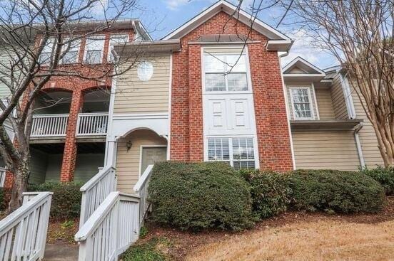 1731 Pryor Rd SW Unit 307, Atlanta, GA 30315 - view of front of home featuring brick siding and a balcony