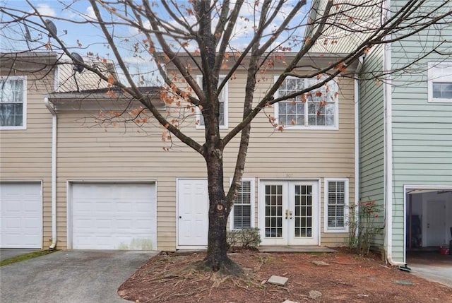 1731 Pryor Rd SW Unit 307, Atlanta, GA 30315 - rear view of house featuring french doors, a garage, and driveway