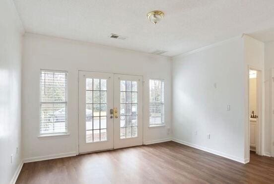 1731 Pryor Rd SW Unit 307, Atlanta, GA 30315 - unfurnished room featuring wood finished floors, french doors, plenty of natural light, and ornamental molding