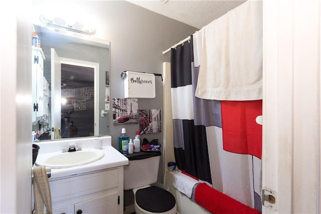 full bath featuring toilet, shower / tub combo with curtain, vanity, and a textured ceiling