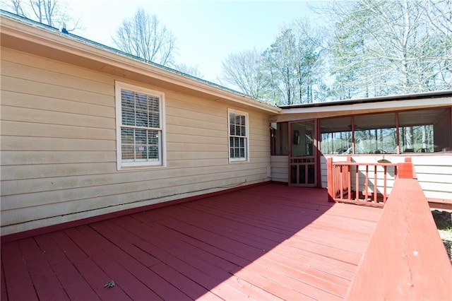 wooden terrace featuring a sunroom