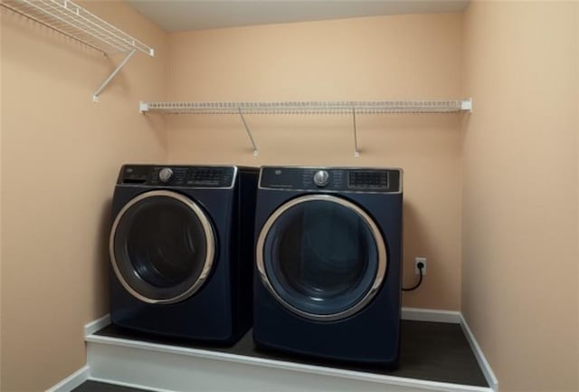 714 Arden Dr, Winder, GA 30680 - washroom featuring washer and clothes dryer and baseboards