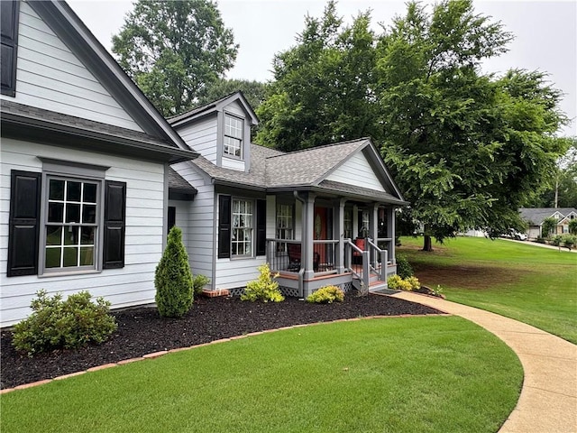714 Arden Dr, Winder, GA 30680 - view of side of property with a porch, a yard, and roof with shingles