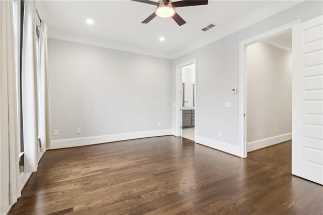 unfurnished room with visible vents, ornamental molding, recessed lighting, baseboards, and dark wood-style flooring