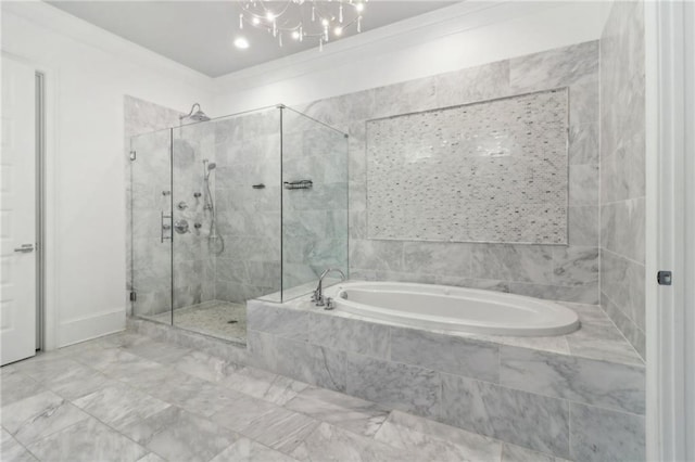 bathroom with a stall shower and a garden tub