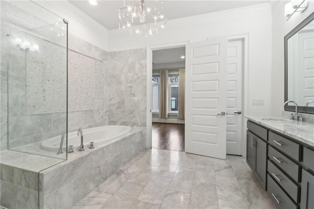 full bath featuring ornamental molding, a bath, a notable chandelier, vanity, and a shower