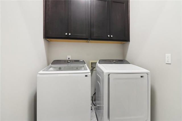 laundry area with cabinet space and washing machine and dryer