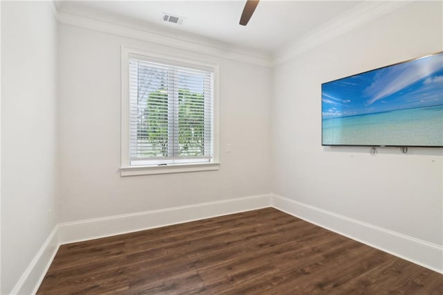 unfurnished room with a ceiling fan, baseboards, visible vents, dark wood-style flooring, and ornamental molding