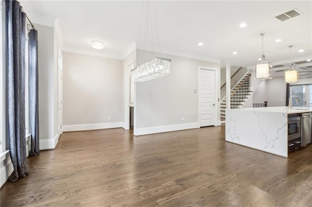 unfurnished living room featuring stairway, baseboards, visible vents, dark wood-style flooring, and ornamental molding