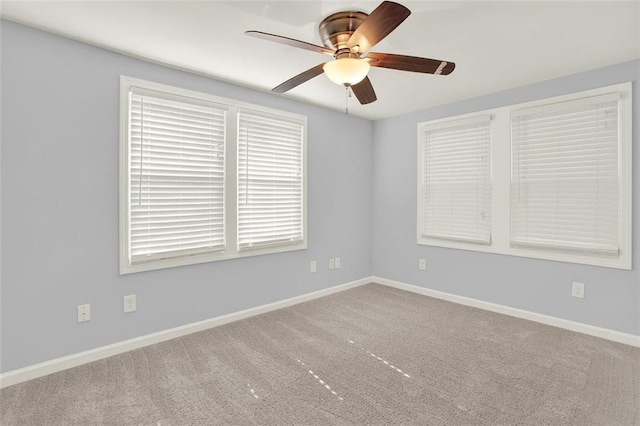 empty room with carpet floors and ceiling fan