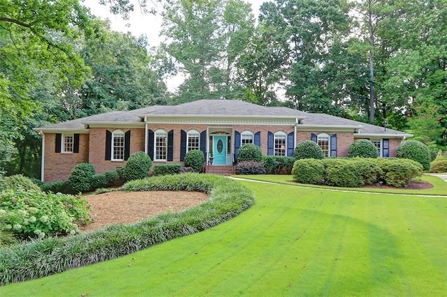 ranch-style home with a front yard