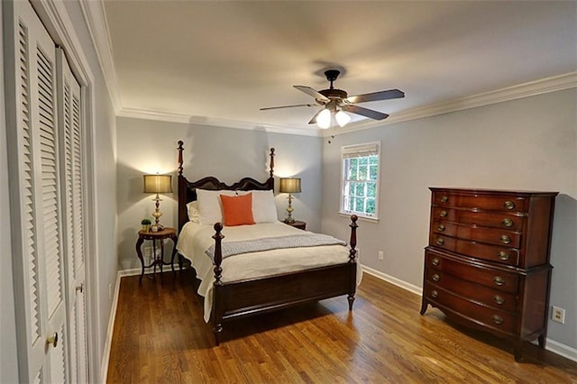 bedroom with dark hardwood / wood-style floors, ceiling fan, and ornamental molding