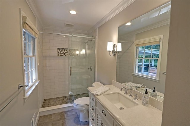 bathroom featuring toilet, a shower with door, vanity, crown molding, and tile flooring