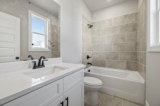 full bath with tile patterned floors, shower / washtub combination, toilet, and vanity