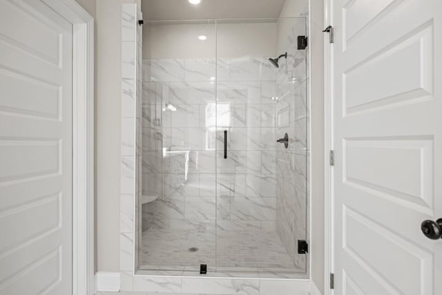 full bathroom featuring a shower stall