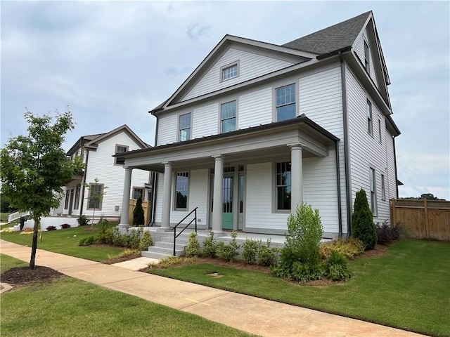 view of front of house with a front lawn and a porch