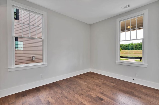 unfurnished room featuring hardwood / wood-style floors