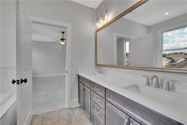 bathroom featuring ceiling fan and vanity